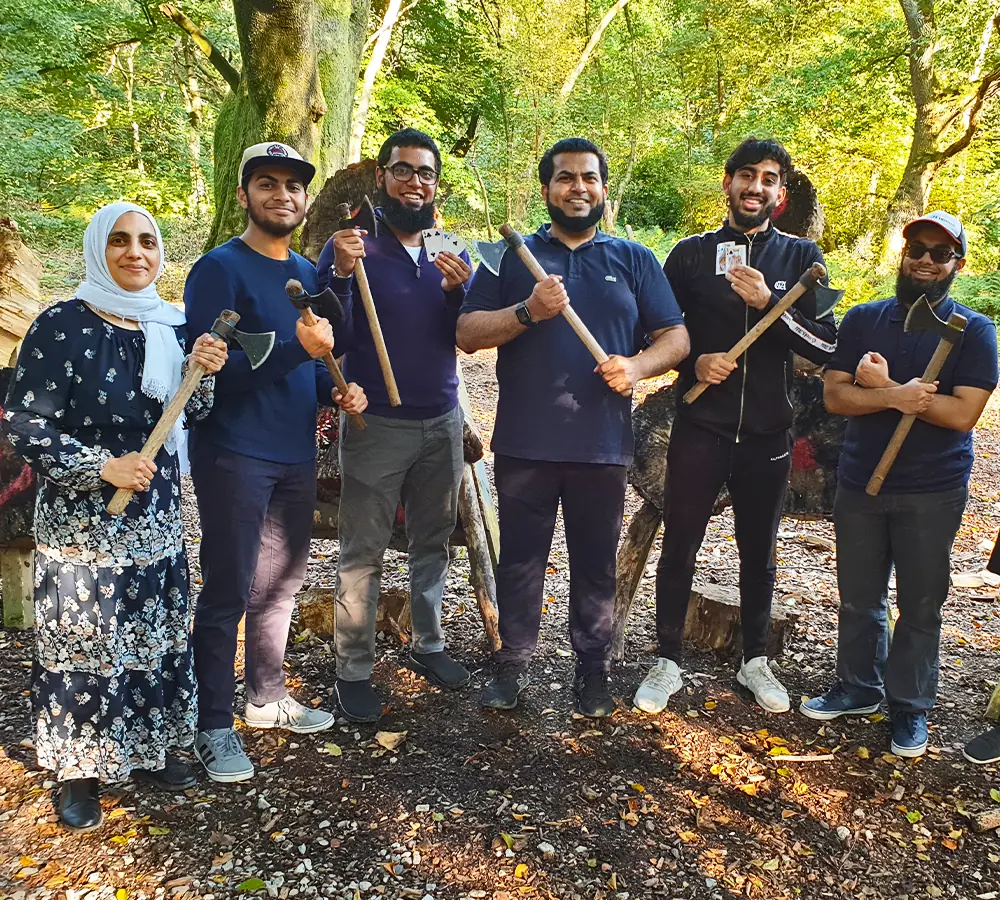 Family group photo of axe throwing at Adventure Now in Manchester