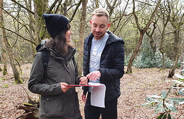 Couple orienteering doing Catchphrase Quest at Adventure Now Manchester