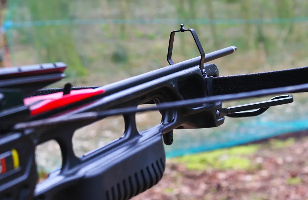 Closeup of a loaded crossbow showing the stirrup and foresight