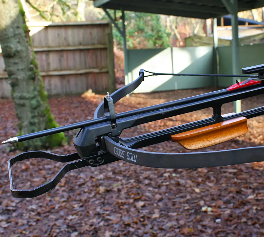 Closeup photo of a crossbow loaded with a crossbow bolt