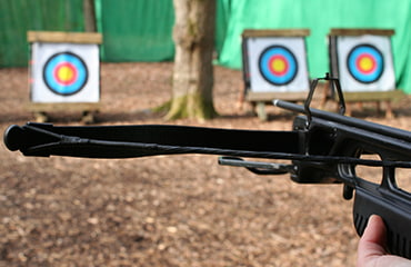Crossbow aiming at target at Adventure Now Manchester