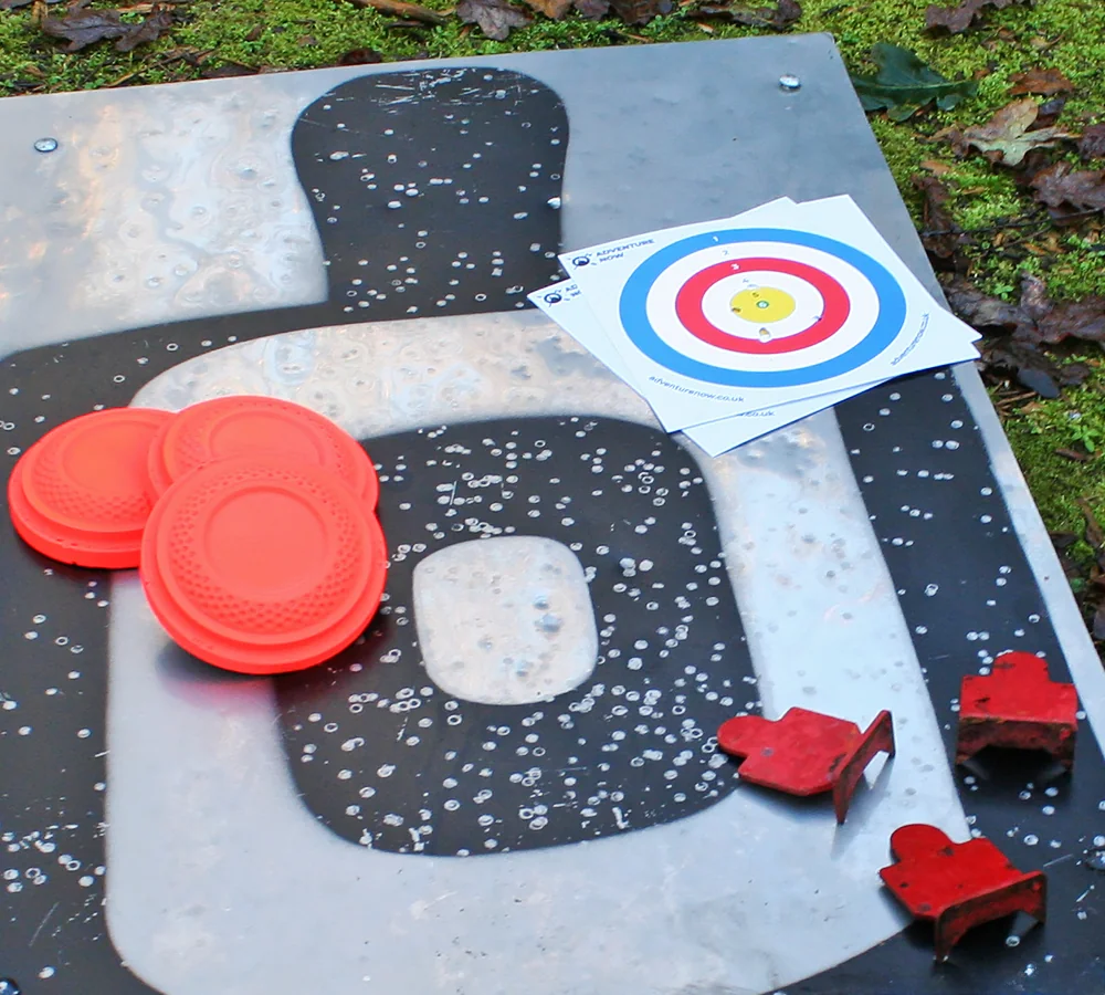 Photo showing a selection of pistol targets. Large silhouette, target cards, clays and small silhouettes