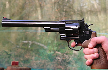 Shooting Smith and Wesson M29 handgun at Adventure Now Manchester