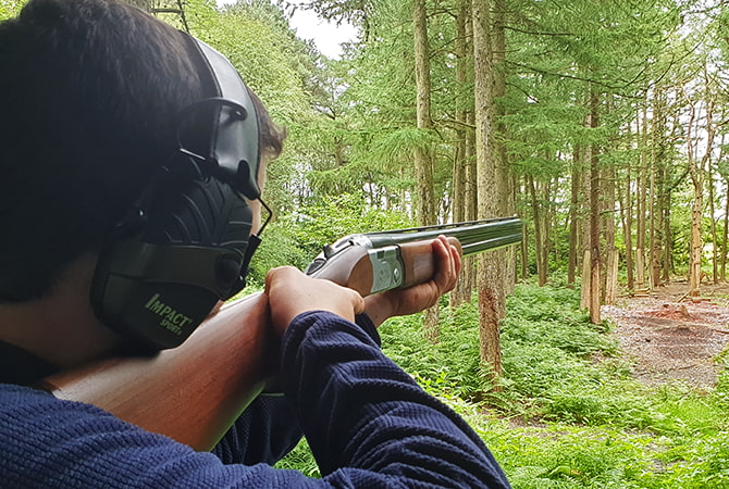 Clay pigeon shooting with a shotgun at Adventure Now Manchester